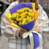 9 желтых Ранункулюсов в упаковке