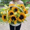 Подсолнухи в корзине